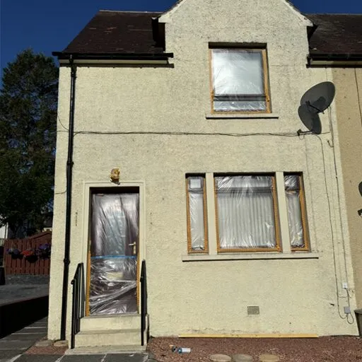 Front of the house and garage before painting
