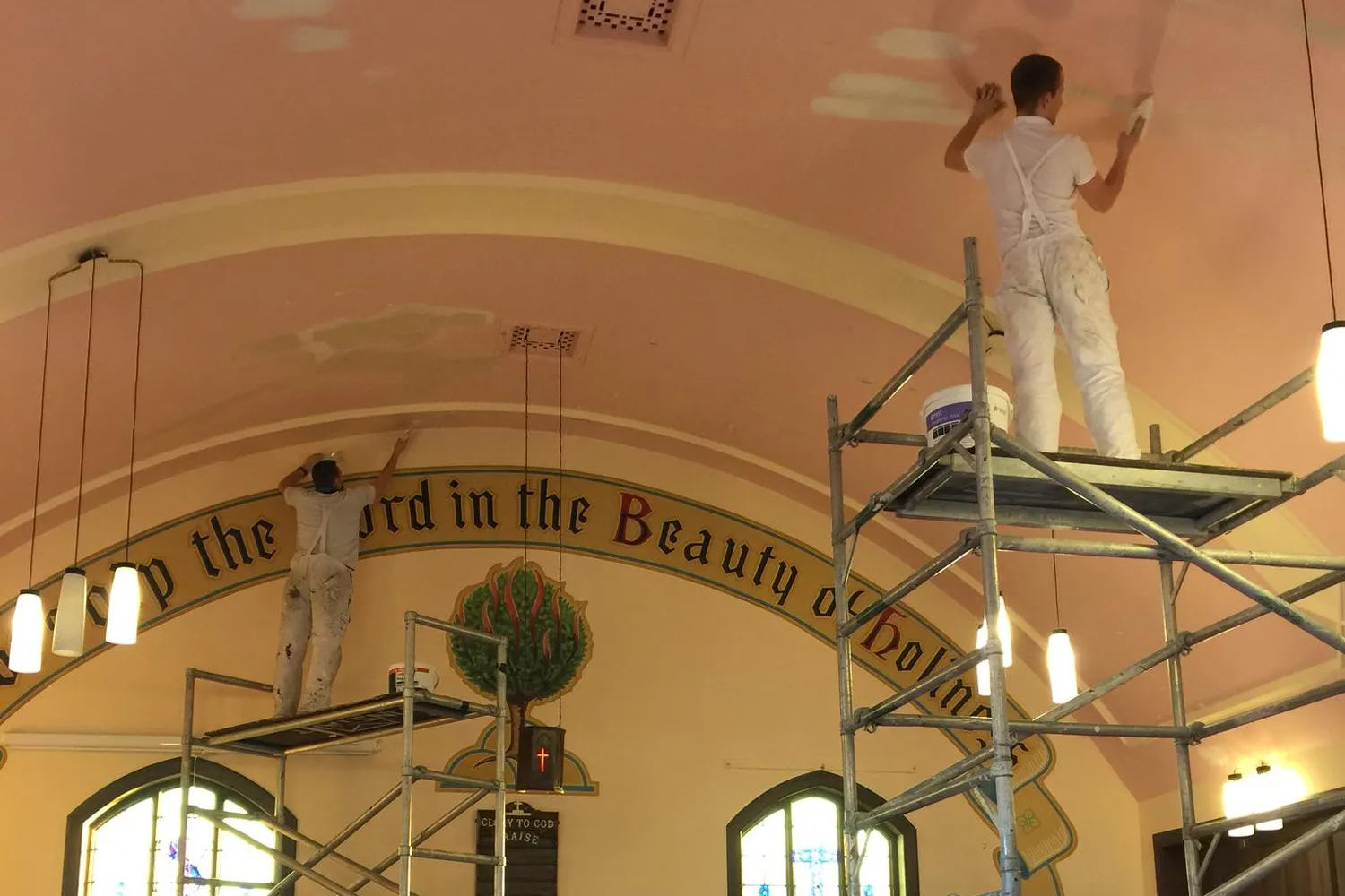 Dingwall Decorators taping and smoothing the rough church ceiling