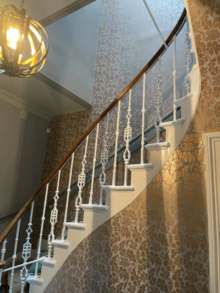 Feature wall wallpaper installation with clean finish